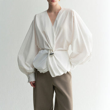 Blusa de primavera de mezcla de algodón con diseño de nudo asimétrico